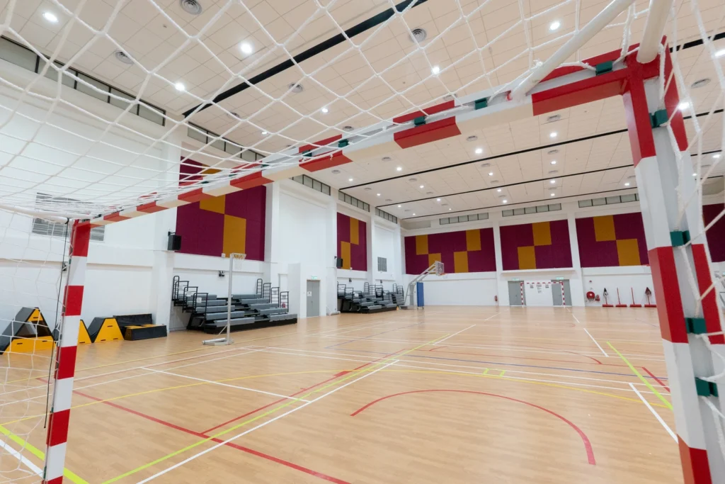 The multi-purpose hall marked out as an indoor basketball court.