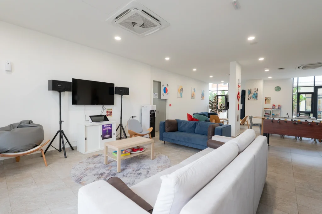 The boarding common room, with sofas, a television, table football and a games area.