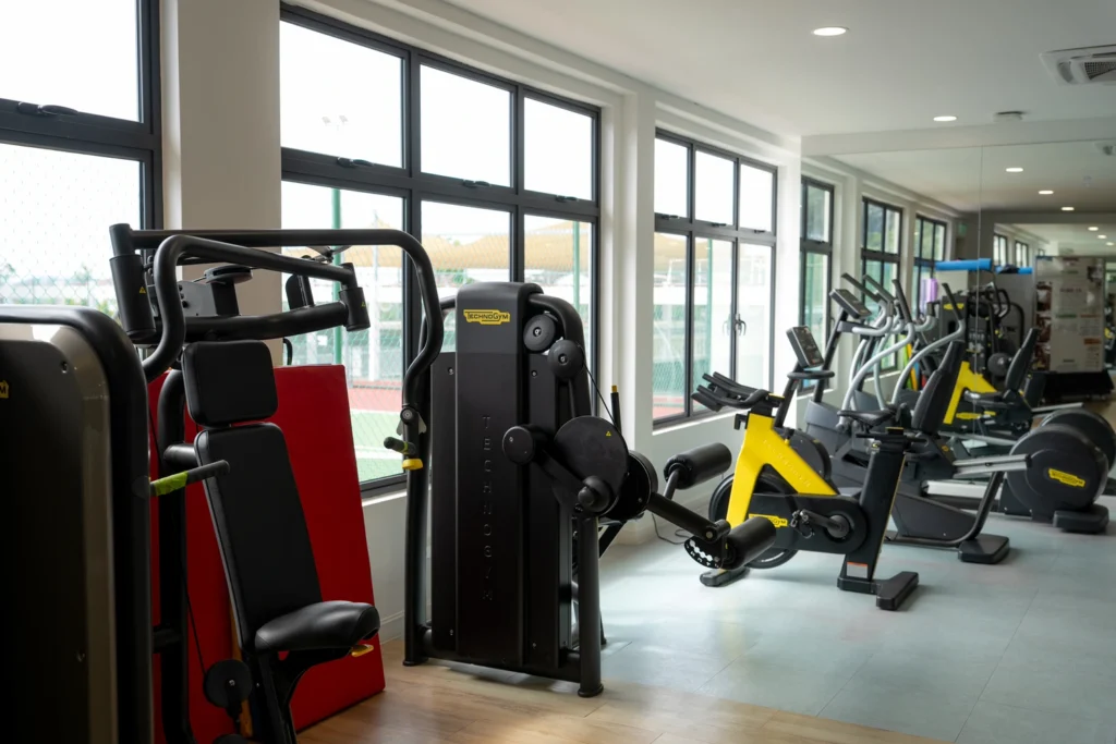 Resistance machines and exercise bikes in the school gymnasium.